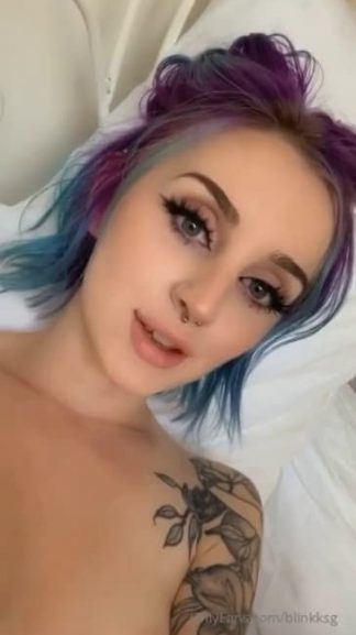 Pretty dyed hair girl chatting and sending nude snaps to her friends in quarantine